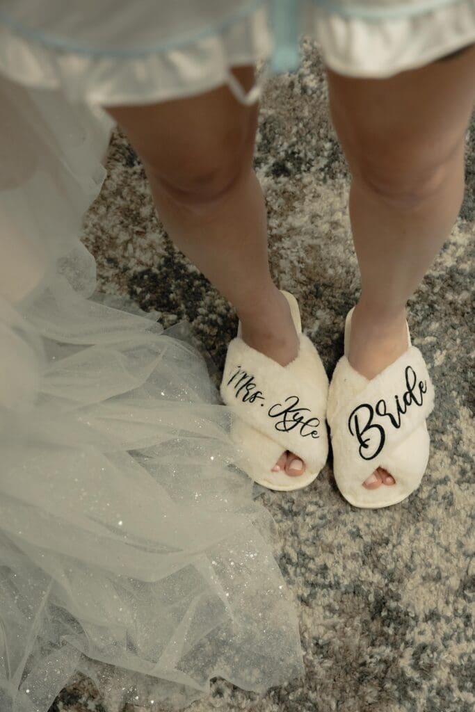 Slippers bride is wearing to get ready in that say bride and Mrs.Kyle